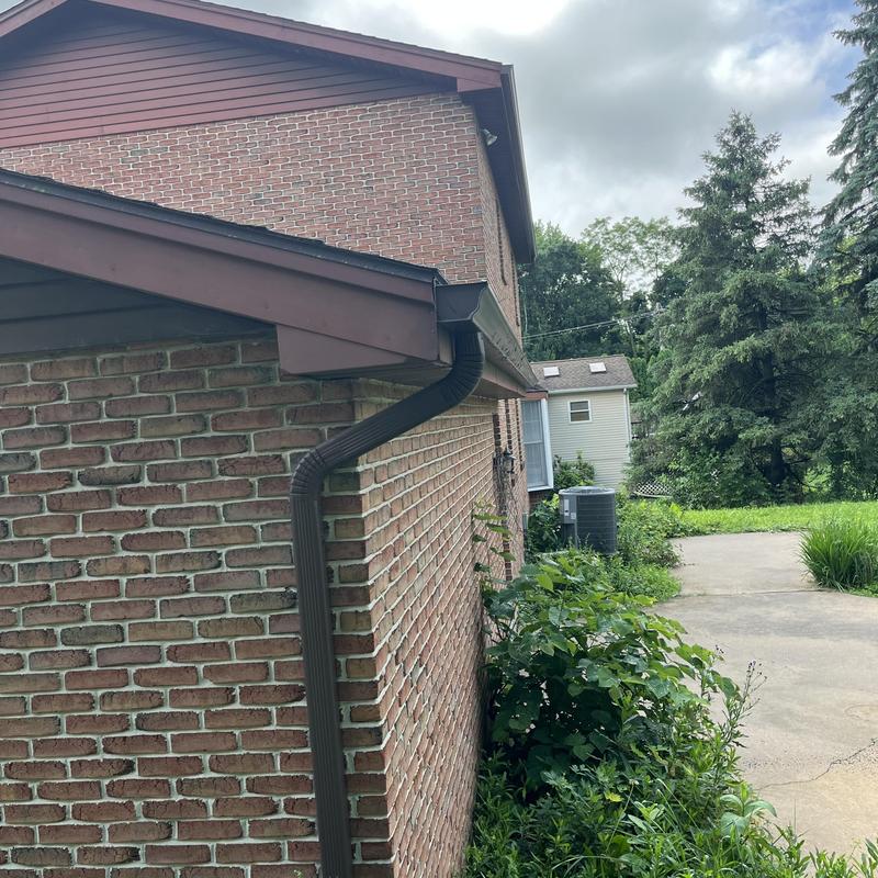 Gutter downspout directing water away from foundation Gutter downspout directing water away from foundation