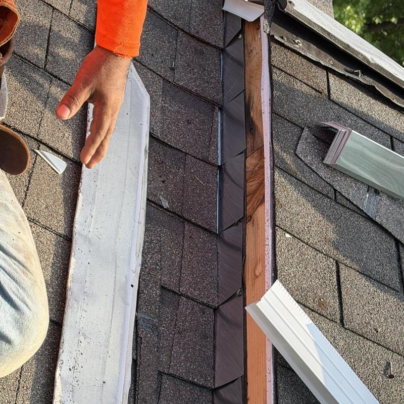 Step flashing installation on shingle roof with ice shield Step flashing installation on shingle roof with ice shield