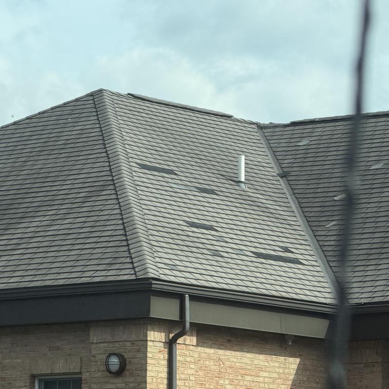 Asphalt shingles roof with multiple damaged spots Asphalt shingles roof with multiple damaged spots