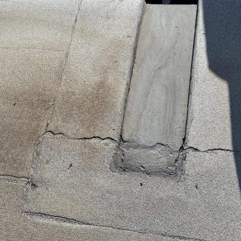 Commercial roof patch with sealant and cracks Commercial roof patch with sealant and cracks