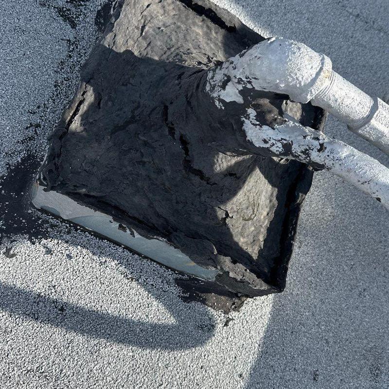 Roof drain flashing with sealant on commercial roof Roof drain flashing with sealant on commercial roof