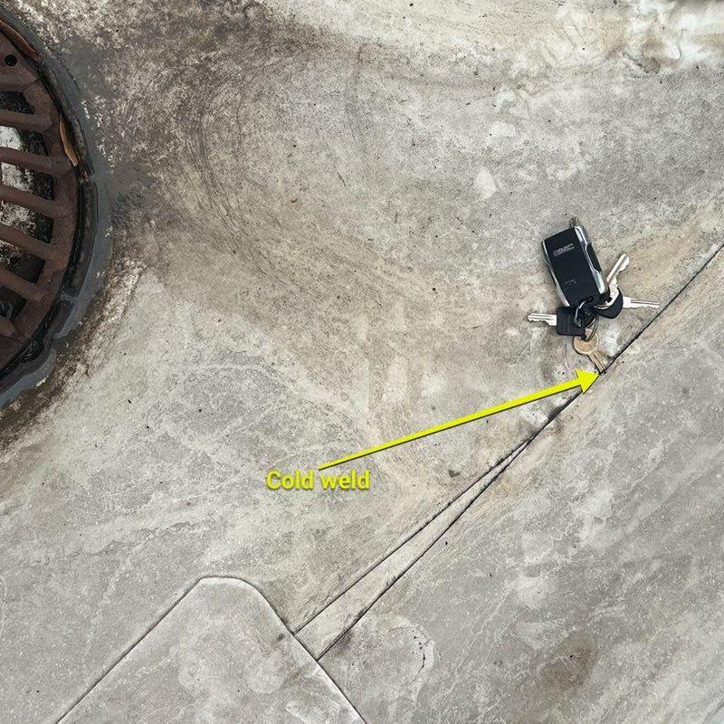 Roof membrane cold weld near drain area with key fob Roof membrane cold weld near drain area with key fob