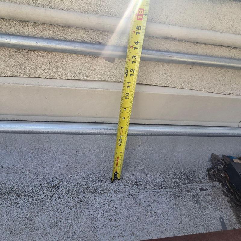 Commercial roof membrane measuring tape on roofing surface Commercial roof membrane measuring tape on roofing surface