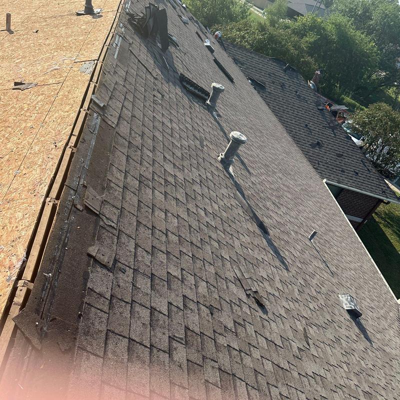 Asphalt shingle roof with damaged and missing shingles Asphalt shingle roof with damaged and missing shingles