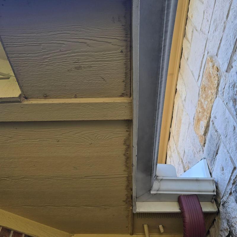 Roof gutter and soffit area with discoloration marks Roof gutter and soffit area with discoloration marks