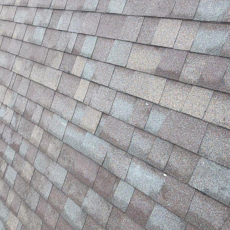 Asphalt shingle roofing with hail damage inspection