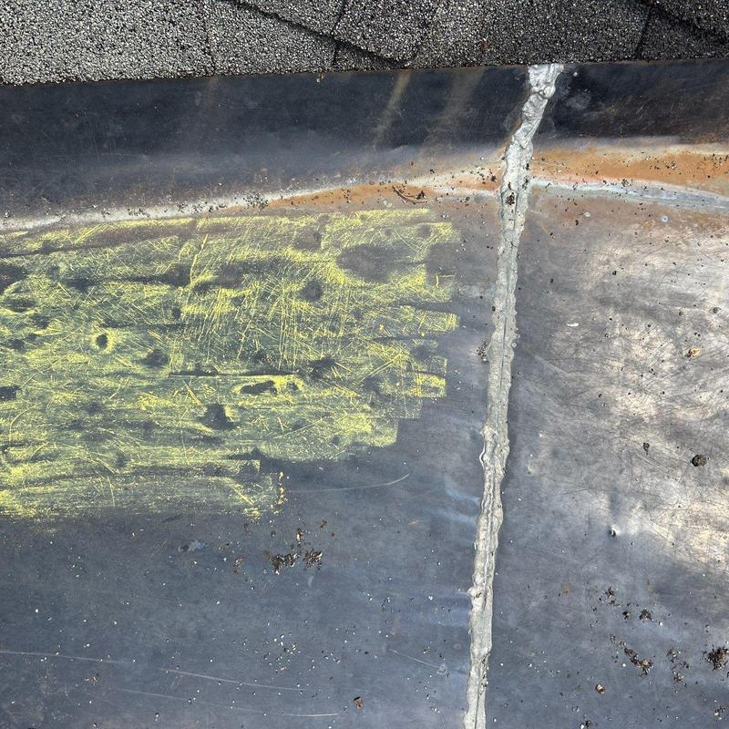 Roof flashing with sealant and chalk markings