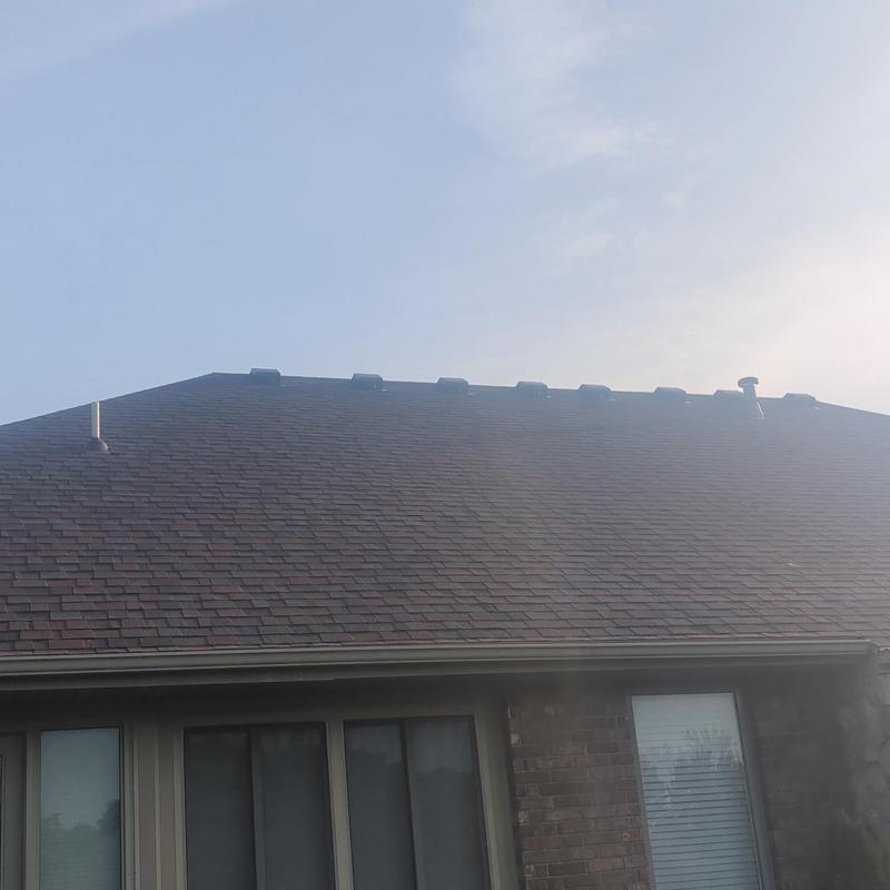 Owens Corning Merlot shingle roof with vents and skylight