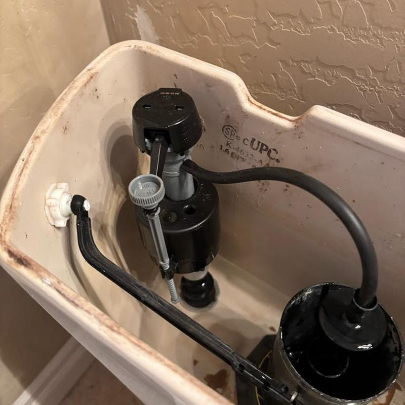 Toilet fill valve and flush mechanism inside tank