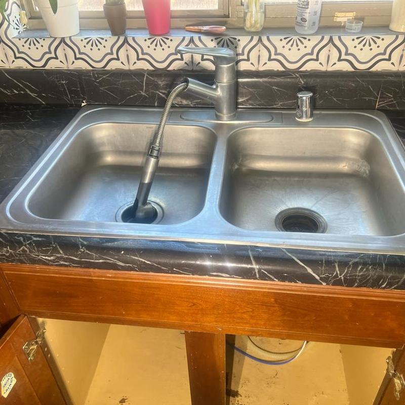 Kitchen sink and faucet installation with disposal setup
