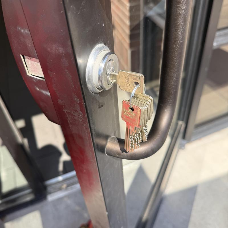 IC core lock with new keys on glass door handle