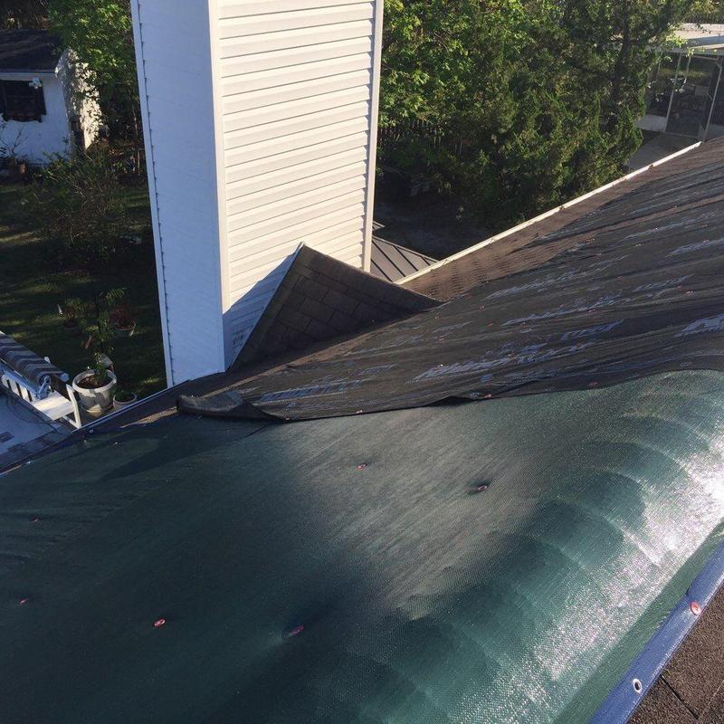 Roof underlayment lifting near chimney on residential house