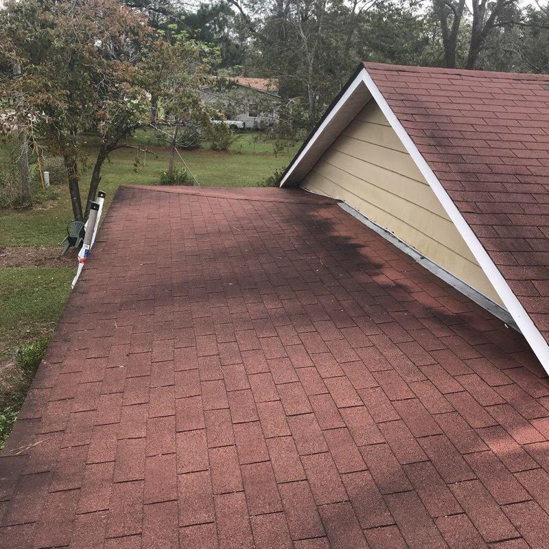 Asphalt shingle roof inspection near flashing and trim