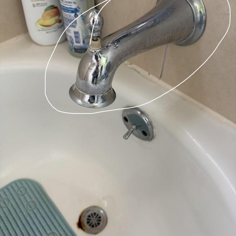 Tub spout with diverter lever on bathtub installation