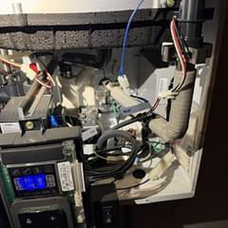 Tankless water heater intake filter cleaning and inspection