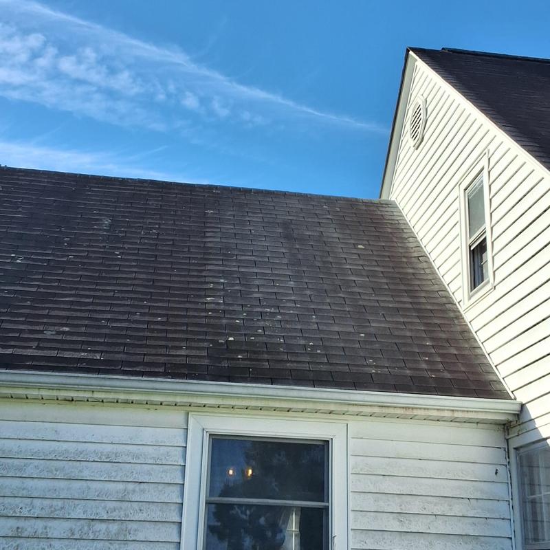 Asphalt shingle roof with wear and aging signs Asphalt shingle roof with wear and aging signs