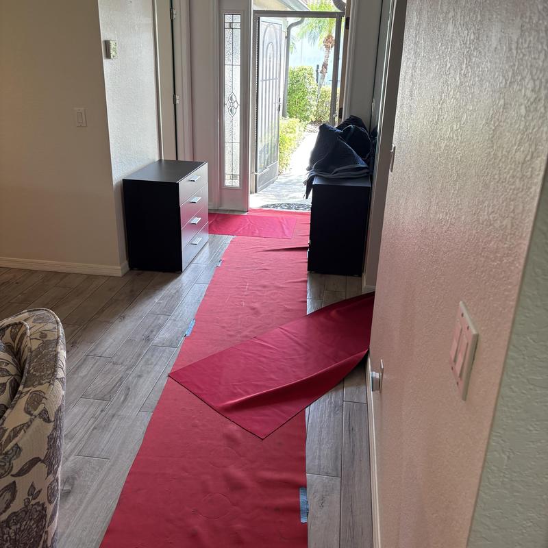 Furniture protection blankets and floor runners laid out