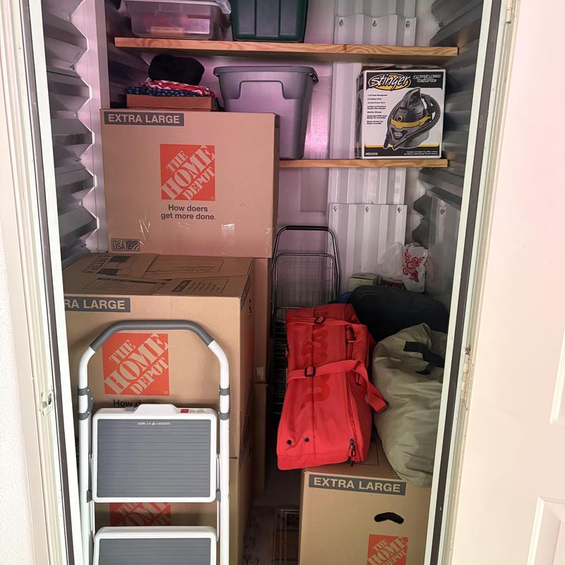 Storage unit packed with boxes and bags