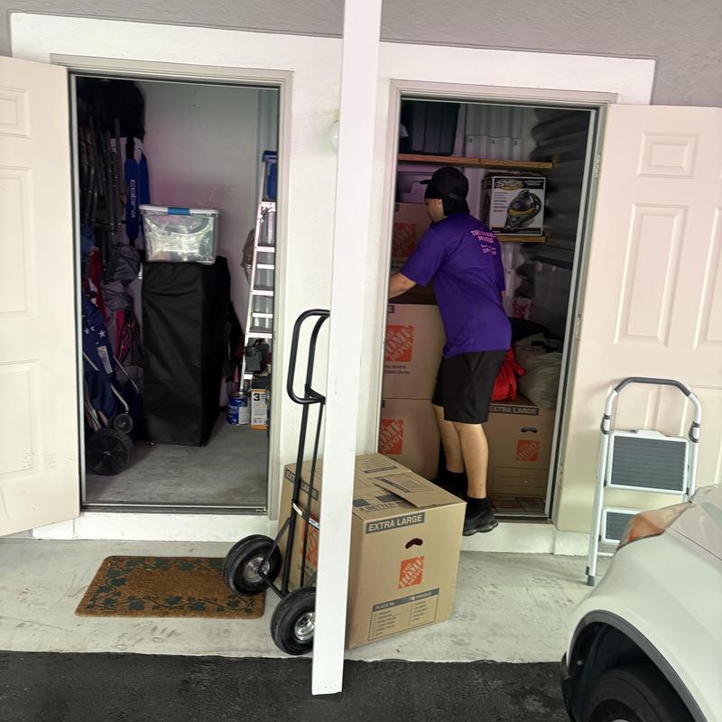 Storage unit boxes and belongings being moved