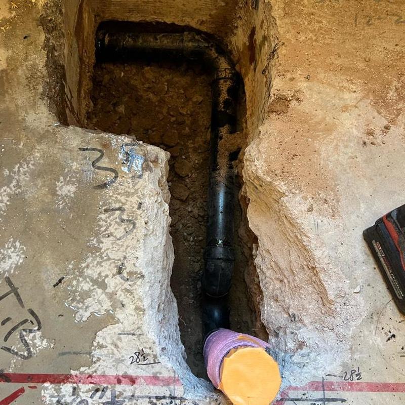 ABS drain pipe replacement in concrete floor trench