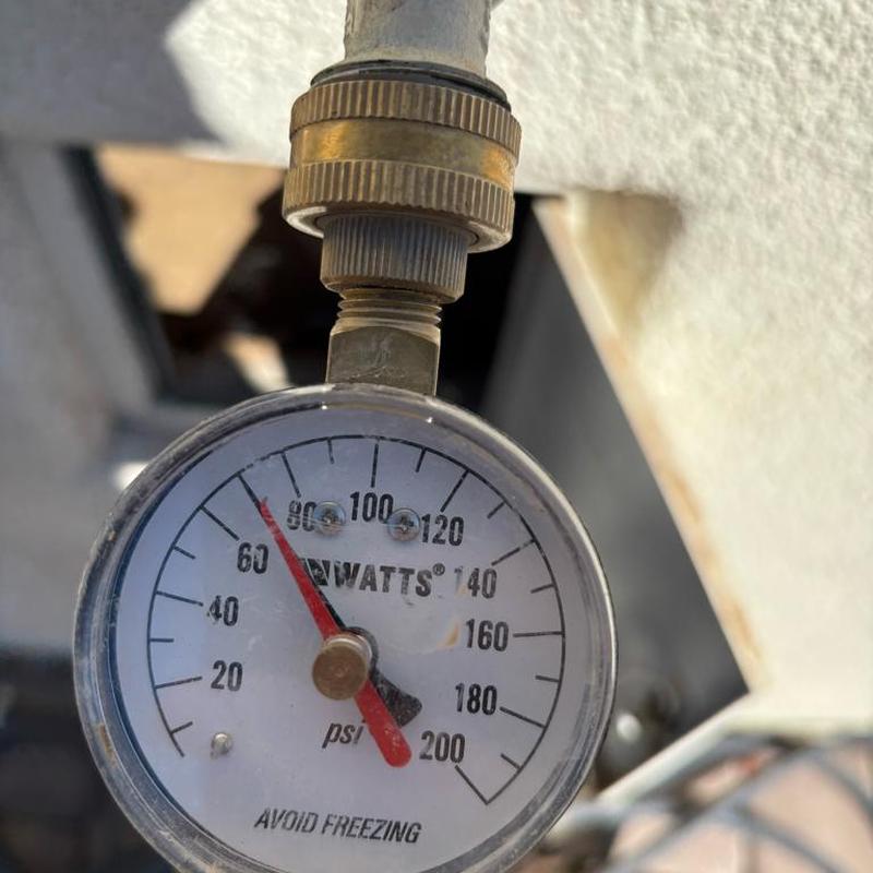 Pressure relief valve gauge showing 70 psi pressure reading