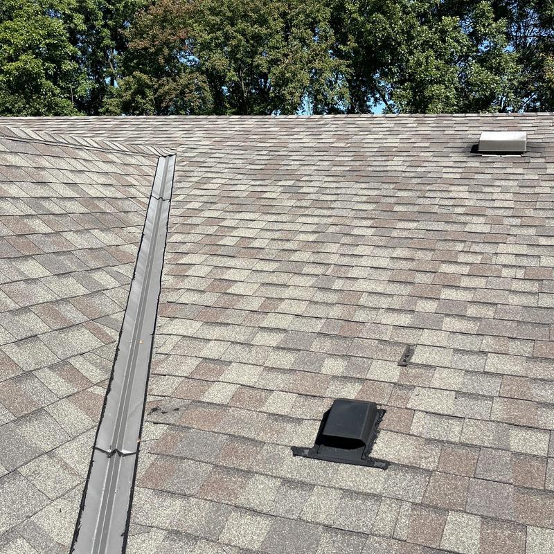 Roof shingles and vent pipe leak inspection on residential roof Roof shingles and vent pipe leak inspection on residential roof