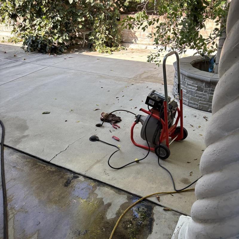 Hydrojetter clearing branch line through area drain