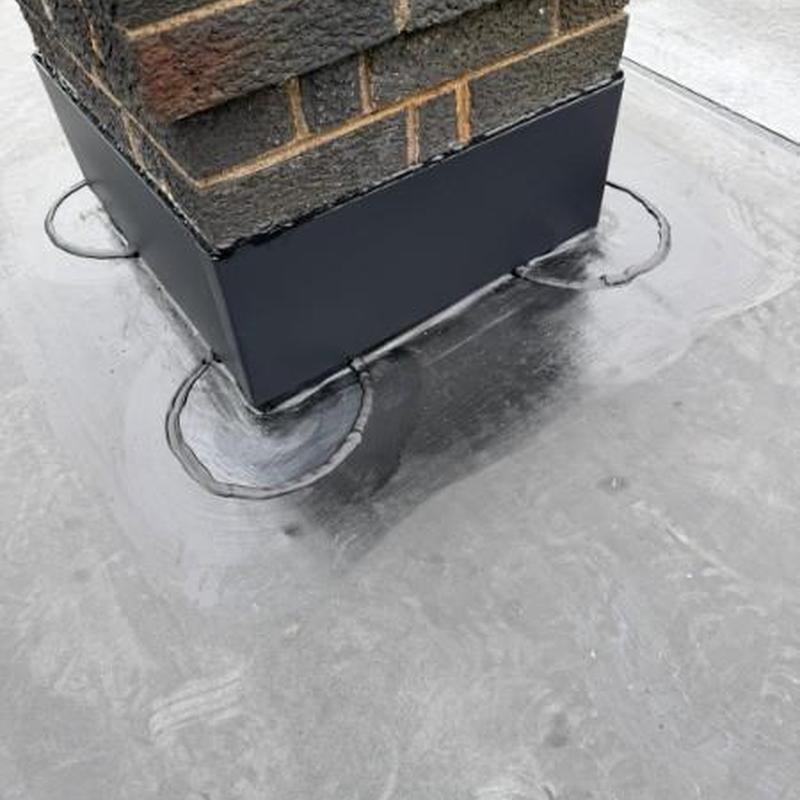 EPDM chimney flashing on flat rubber roof repair