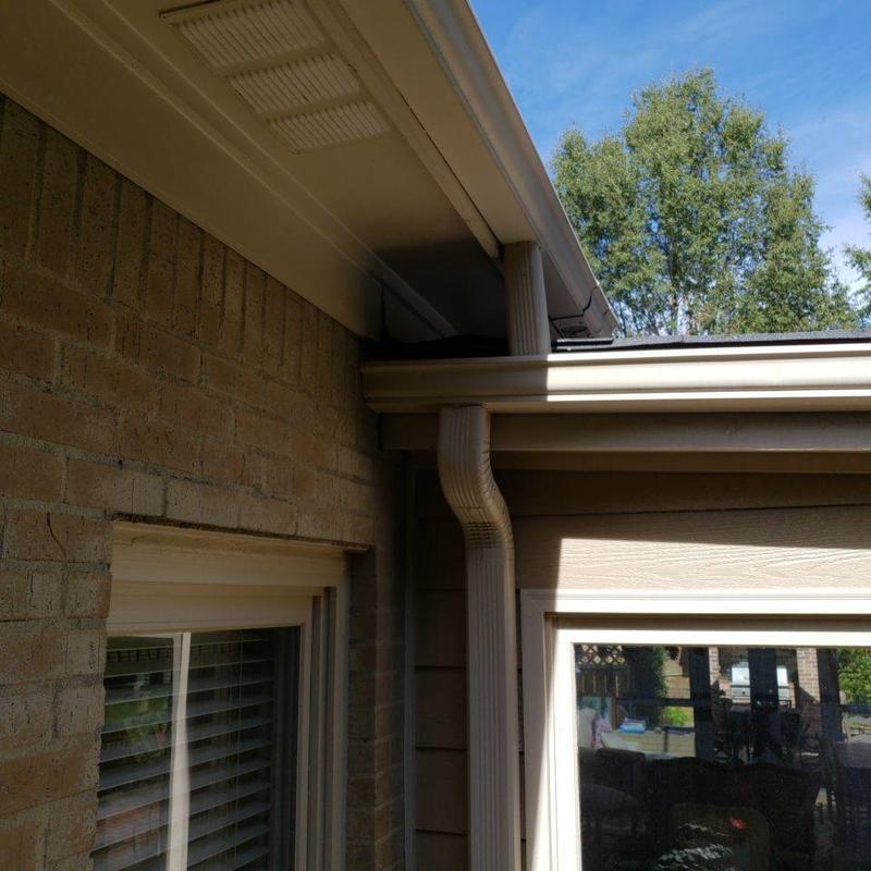 Gutter downspout and roof transition inspection outdoors