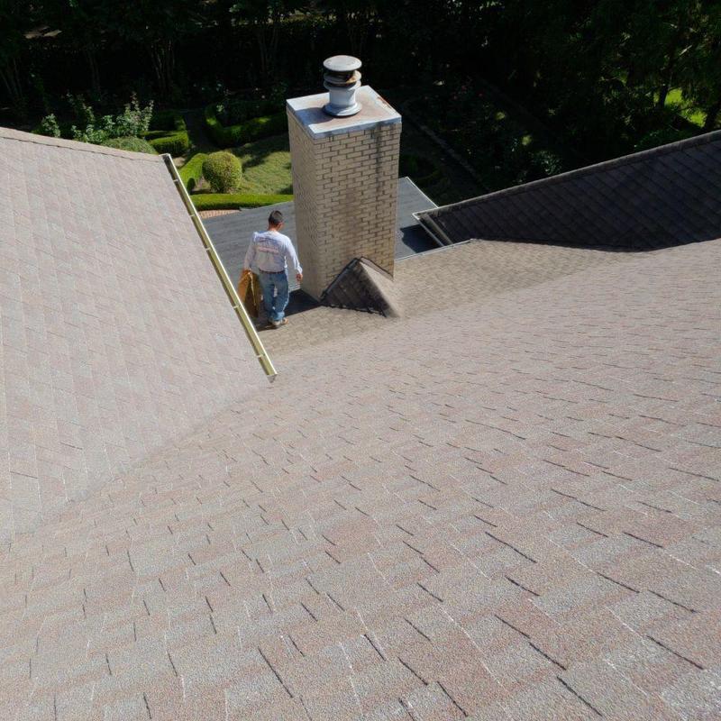 Asphalt shingle roof with chimney and ridge cap inspection