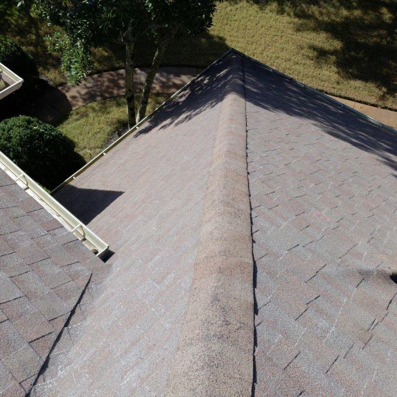 Asphalt shingle roof ridge inspection for hail damage