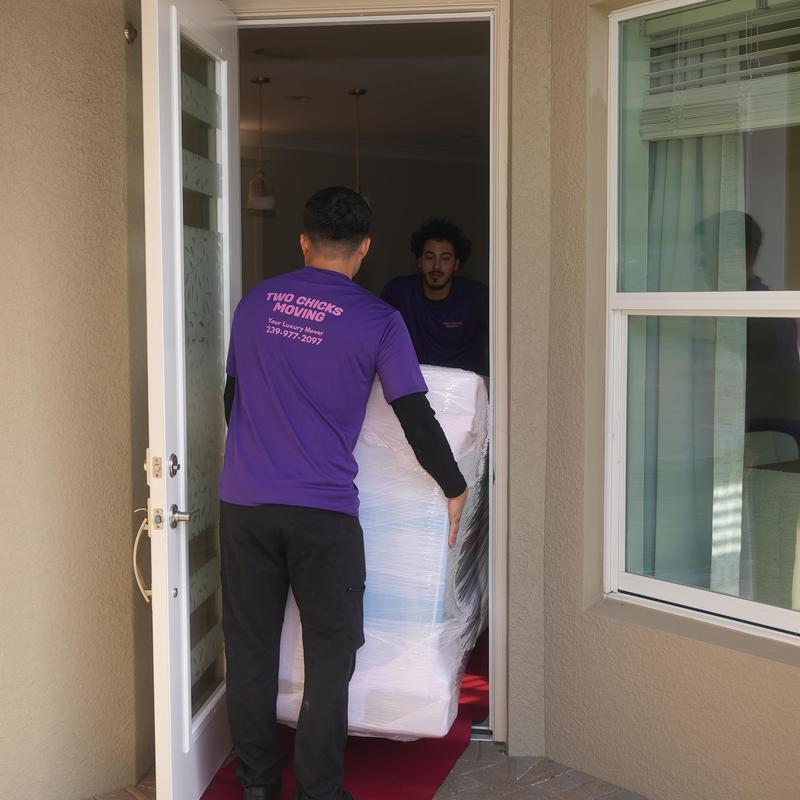 Wrapped furniture being moved through doorway in Fort Myers