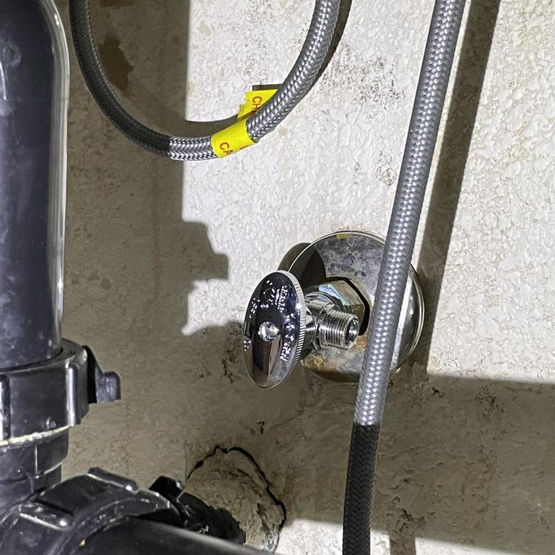 Compression angle stop valve under kitchen sink with hoses