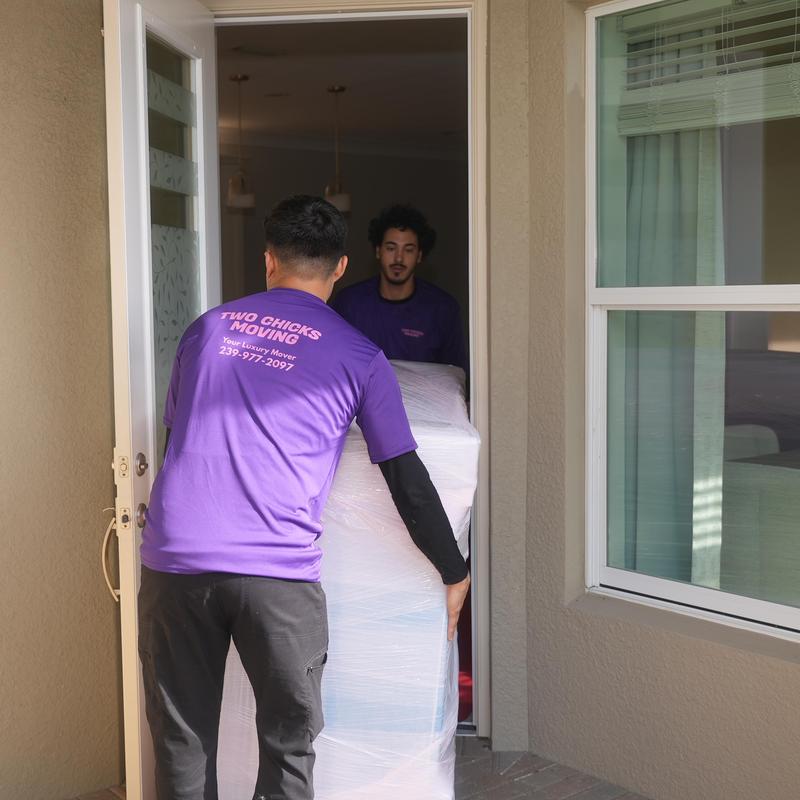 Wrapped furniture moving through front door in Cape Coral