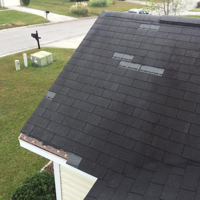 Asphalt shingle roof with hail damage inspection detail