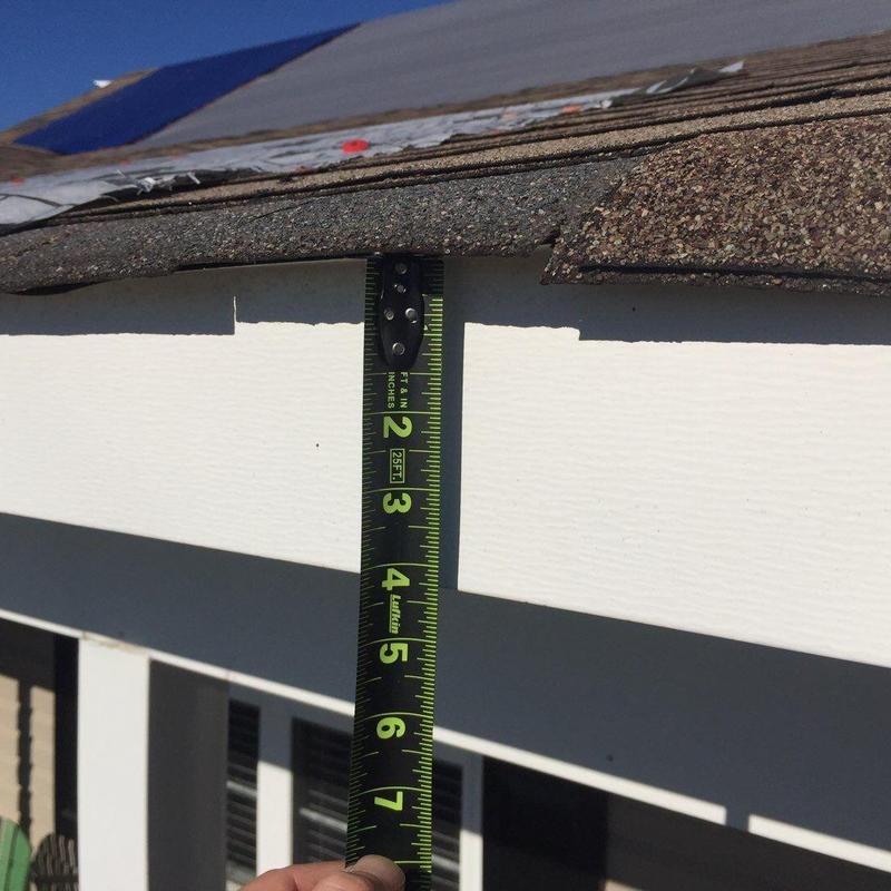Roof shingles and fascia board measurement with tape