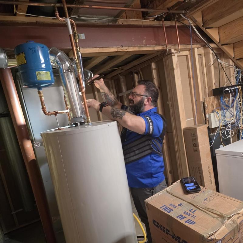 Water heater pipe inspection and flushing in basement