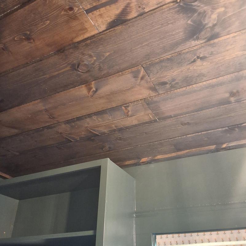 Wood ceiling planks installation over wall cabinets Wood ceiling planks installation over wall cabinets