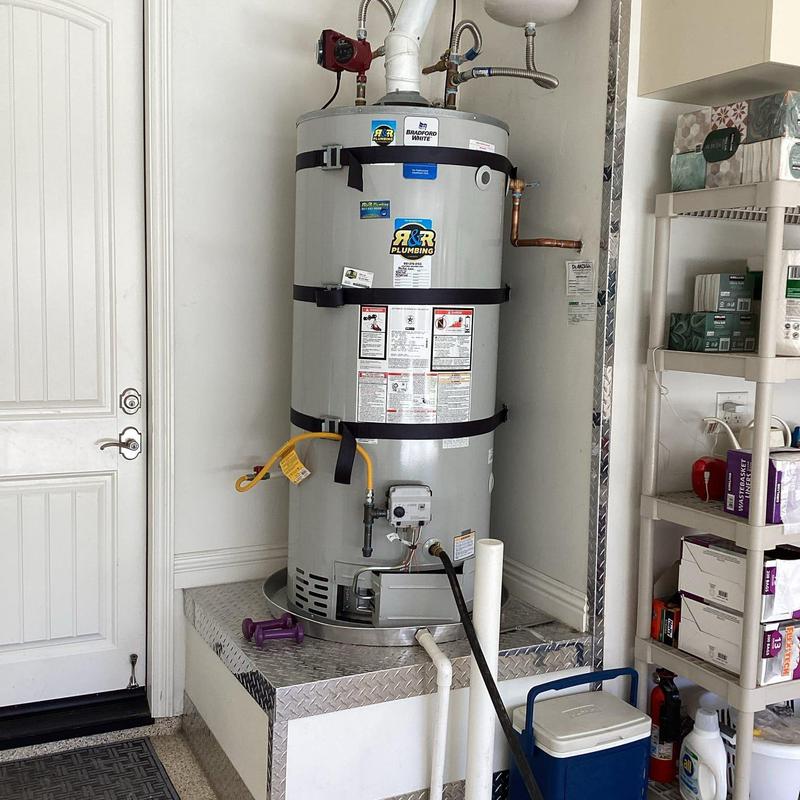 Water heater with hose attached for draining