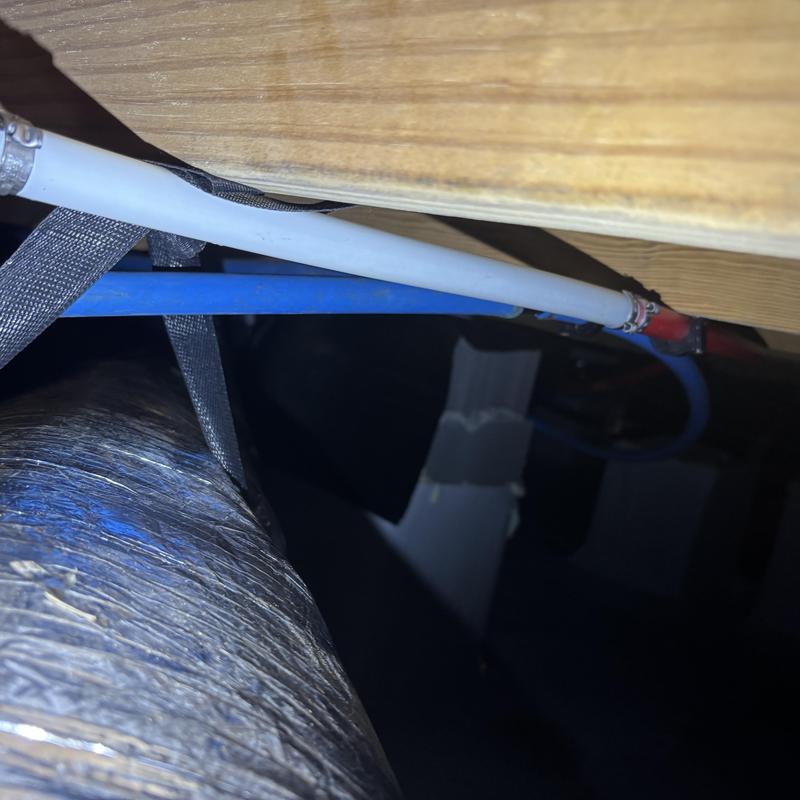 PEX hot water line with repaired section in crawlspace PEX hot water line with repaired section in crawlspace
