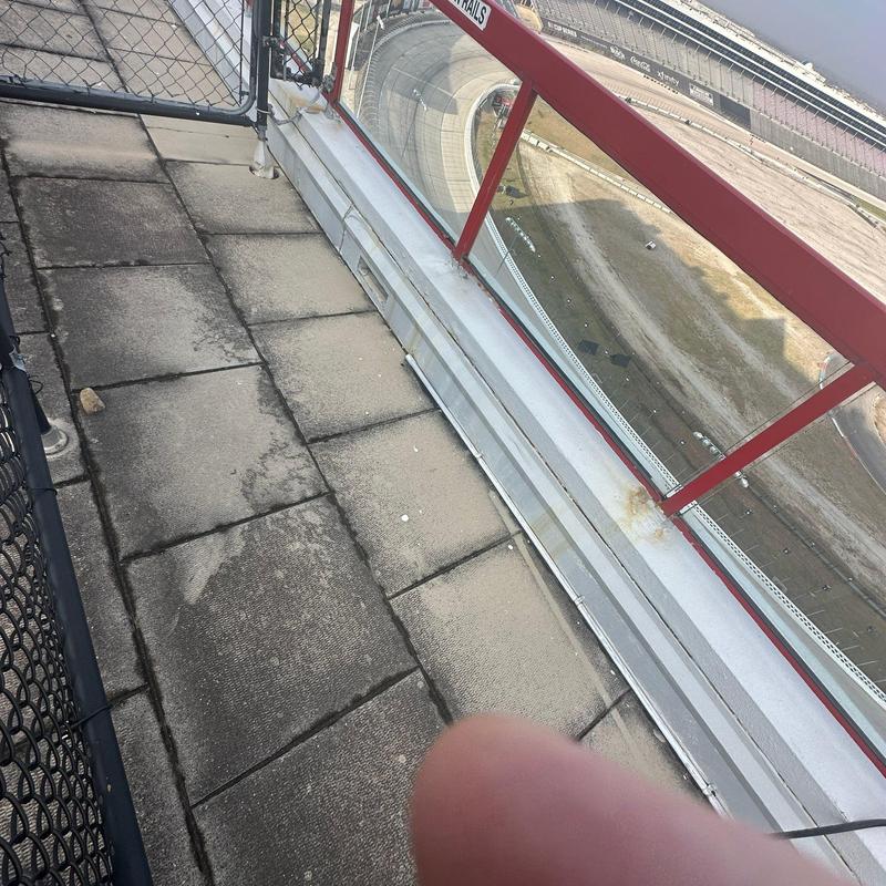 Roof parapet and walkway tiles at stadium edge Roof parapet and walkway tiles at stadium edge