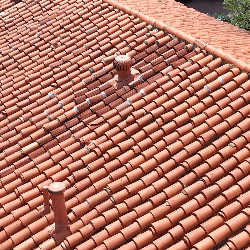 Clay tile roof with turbine vent and pipe flashing Clay tile roof with turbine vent and pipe flashing