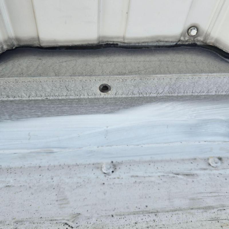 Metal roof panel seam with sealant application detail Metal roof panel seam with sealant application detail