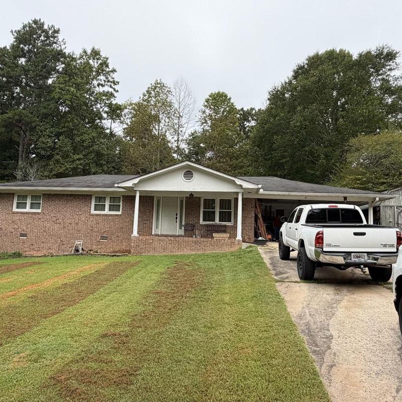 Asphalt shingle roof with inspection and truck nearby Asphalt shingle roof with inspection and truck nearby