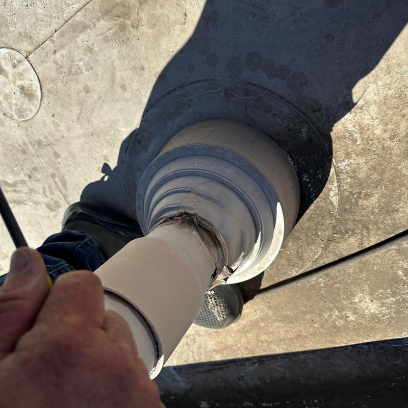 Roof vent pipe flashing inspection on commercial roof Roof vent pipe flashing inspection on commercial roof