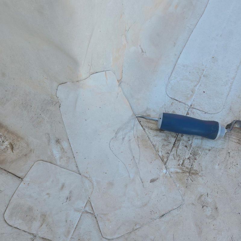 TPO roofing membrane patch with seam roller tool TPO roofing membrane patch with seam roller tool