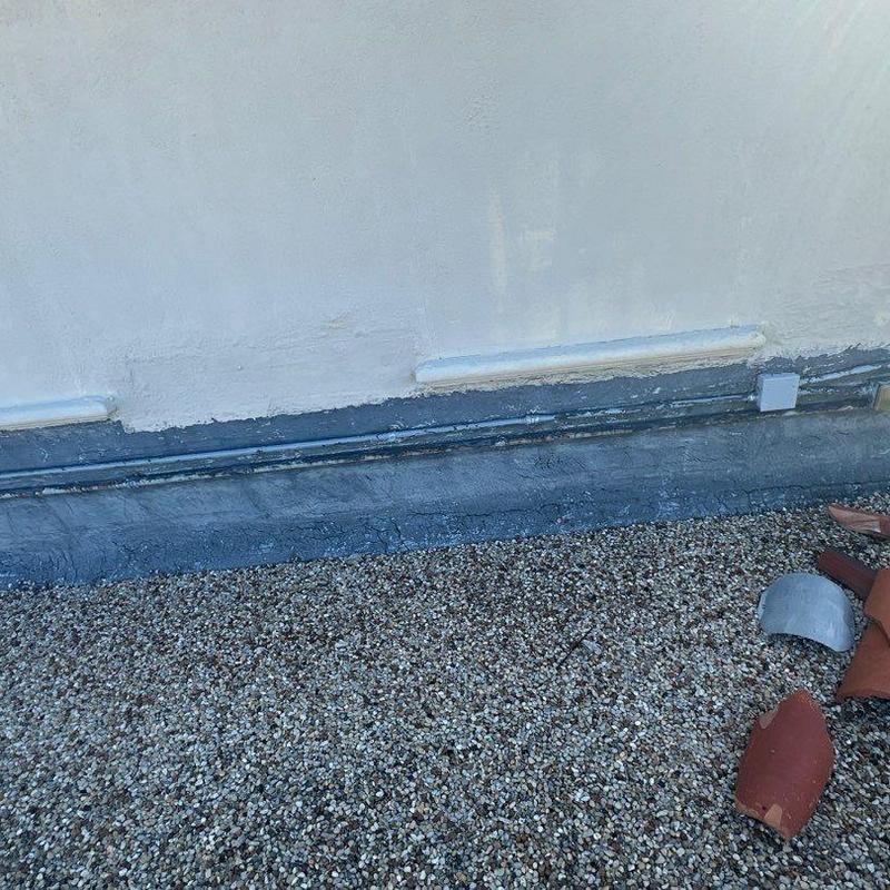 Roof membrane and gravel surface with flashing detail Roof membrane and gravel surface with flashing detail