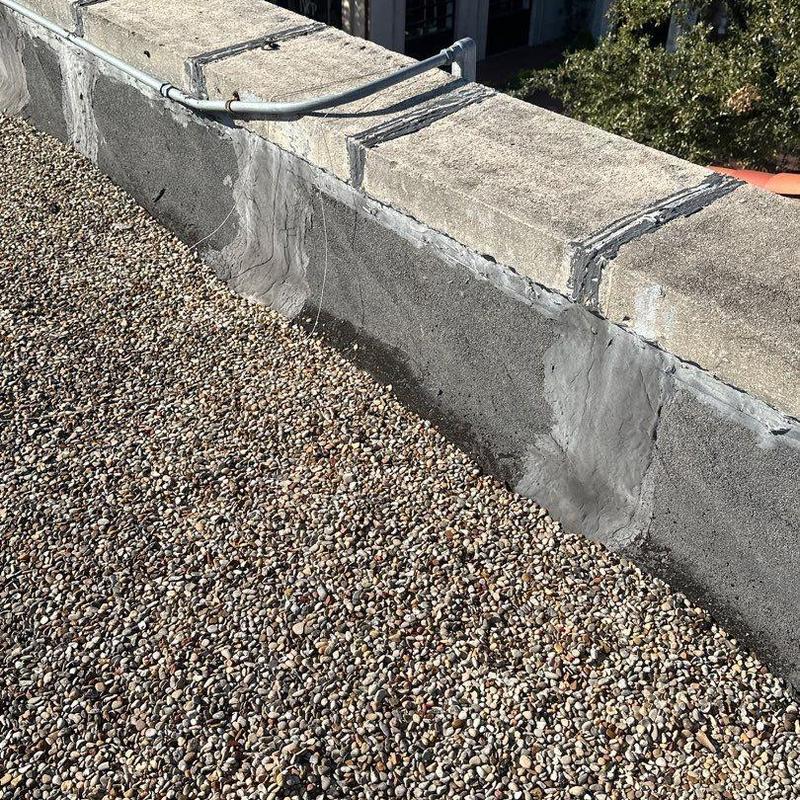 Roof membrane and parapet wall sealant on gravel roof Roof membrane and parapet wall sealant on gravel roof