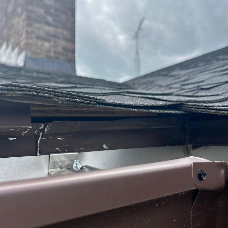 Roof shingle edge and gutter flashing inspection detail