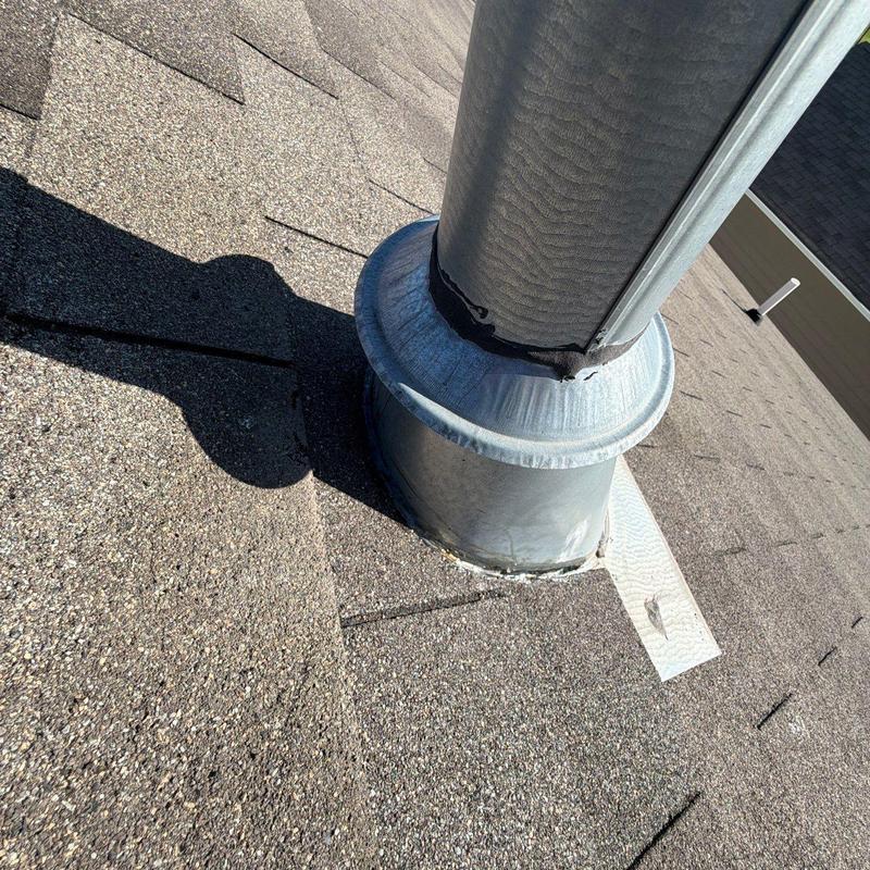 Roof pipe vent flashing on asphalt shingle roof